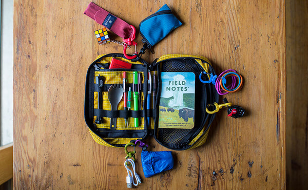 Several Double Carabiners connecting items to o-rings in a Handy Little Thing.